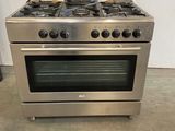 an image of a stainless steel stove top oven sitting in a room