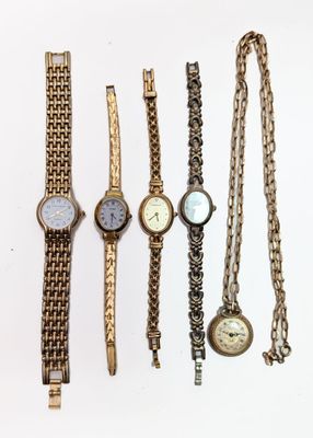 a lot of watches that are sitting on a table