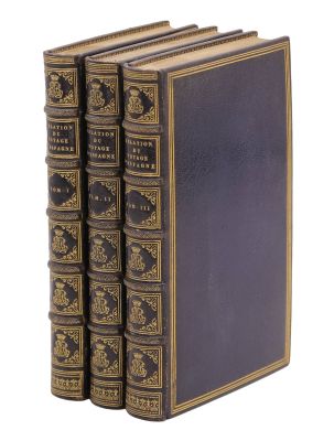 un ensemble de quatre livres anciens sur fond blanc