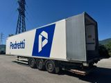 a semi truck that is parked in a parking lot