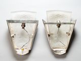 two wall sconces that are attached to the wall