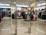an image of a clothing store with clothes on display