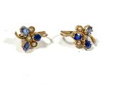 two pairs of earrings with blue and white stones on them