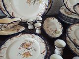 many different types of plates and bowls on the table