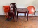 two chairs and a table in the corner of a room