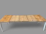 an image of a wooden table with white legs on a gray background