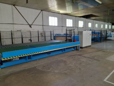 an image of a factory with a conveyor belt in the middle of it