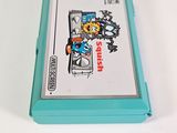 a nintendo game on a white table with a blue case