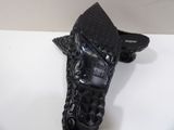 pair of black leather shoes on a white surface with a white background