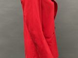 an image of a mannequin wearing a red jacket and black pants