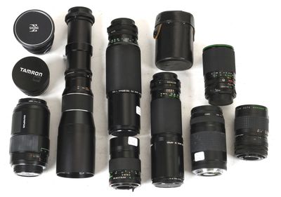 many different types of camera lenses and lenses on the table