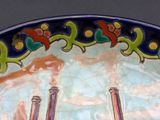 a decorative plate with a picture of a man and a woman on it