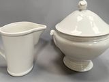creamer and sugar bowl on a gray background with a gray background