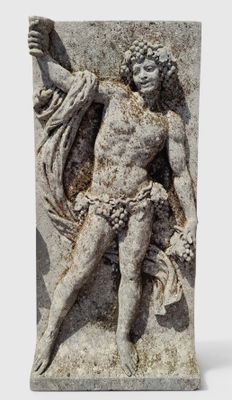 statue of a man holding a flower in his right hand