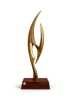 bronze sculpture of a woman ' s face on a wooden base