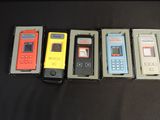several cell phones are lined up in a row on a table