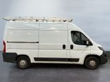 a white van that is parked in a parking lot