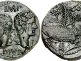 a silver coin with an image of a man and a woman on it