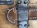 a close up of a suitcase on a wooden floor