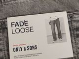 the label on the back of a pair of jeans reads fade loose