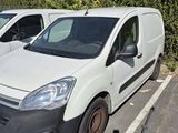 two vans parked in a parking lot next to each other