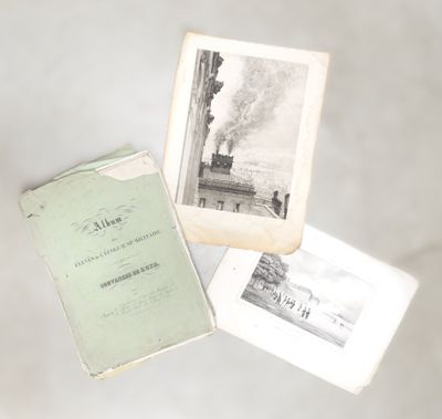 three old books are sitting on top of a white table