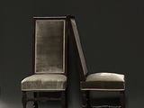 two chairs sitting next to each other in a dark room
