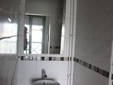 a bathroom with a sink and a mirror in it