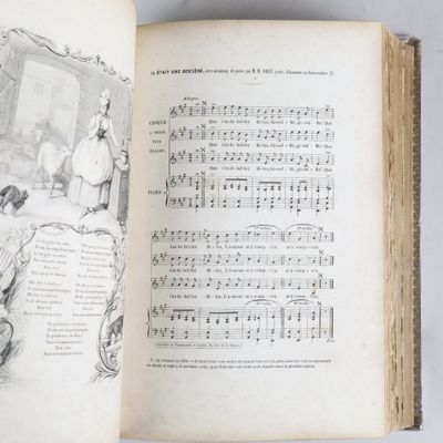 un livre ouvert sur lequel figure le dessin d'un homme et d'une femme assis sur un lit