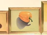 three framed pictures of fruit and a pineapple on the wall