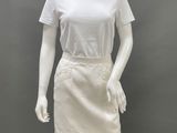 a mannequin wearing a white shirt and skirt on a mannequin mannequin