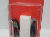 a white box with a battery and wires inside of it
