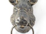 a close up of a metal animal head on a ring