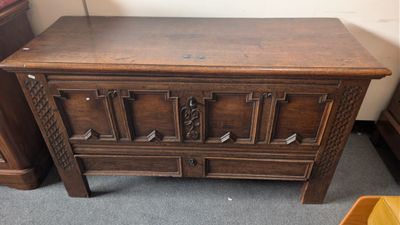 a wooden chest with a drawer on top of it