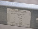 a label on the back of a metal bench