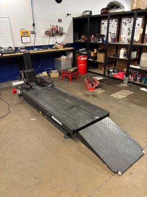 an image of a garage with a ramp in the middle of it