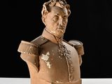 statue of a bust of a man with a cup in his hand