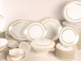 a lot of plates and bowls that are stacked together