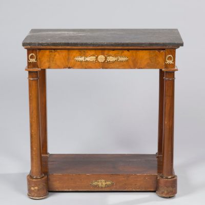 a small table with a marble top and wooden legs