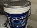 a bucket of paint sitting on top of some buckets