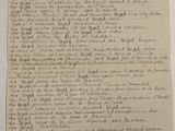 an old document with writing on it sitting on top of a table