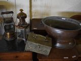 a large metal bowl sitting on top of a wooden table