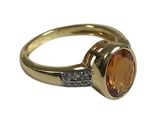 an image of a yellow gold ring with a large citrine stone
