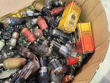 a cardboard box filled with assorted items on a table