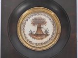 une assiette sur laquelle est représenté un palmier