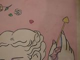 a picture of a painting on the wall of a bathroom