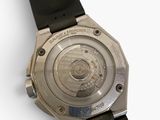 a close up of a watch on a white surface