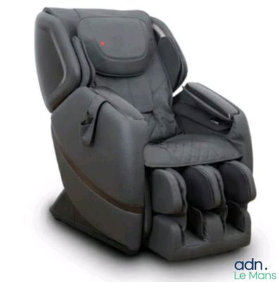 the massage chair is sitting on a white surface