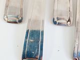 five spoons that are sitting next to each other
