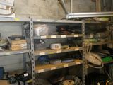 many shelves with various items on them in a garage